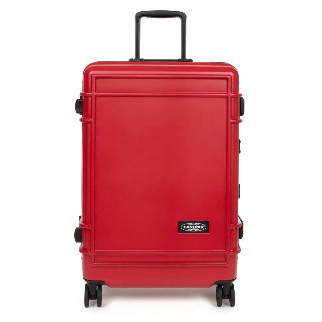 Eastpak Resist'r Case hard-shell luggage in three sizes - small, medium, and large - displayed in red, gray, and black colors. The suitcases feature a sleek polycarbonate exterior with aluminum frame, quiet wheels, and TSA-approved locks. Eastpak logo visible on the front