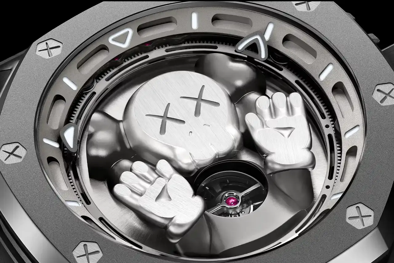 Audemars Piguet Audemars Piguet Royal Oak Concept Tourbillon COMPANION watch with gray KAWS character on sunburst titanium dial, featuring visible tourbillon movement in 43mm titanium case with two gray straps