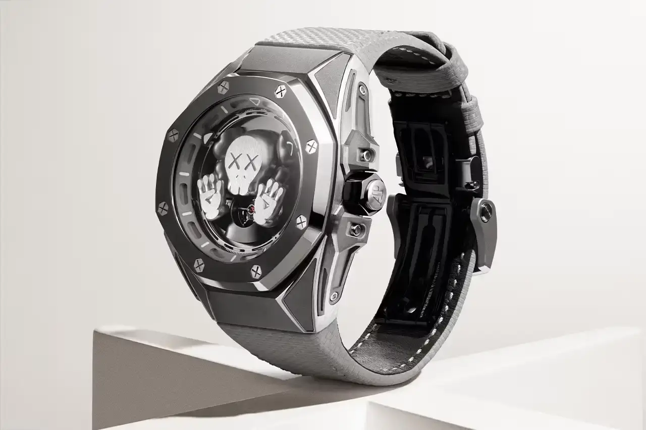 Audemars Piguet Audemars Piguet Royal Oak Concept Tourbillon COMPANION watch with gray KAWS character on sunburst titanium dial, featuring visible tourbillon movement in 43mm titanium case with two gray straps (image 6 of 6)