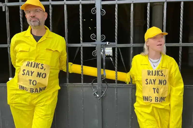 Getty Images Climate activists from Extinction Rebellion protest at Amsterdam's Rijksmuseum, demanding the museum cut ties with ING Bank over climate concerns. Protesters in yellow jumpsuits use smoke bombs and chain themselves to fences, temporarily closing the museum. 33 arrests made as the demonstration highlights the growing trend of targeting cultural institutions for climate activism. (image 4 of 4)