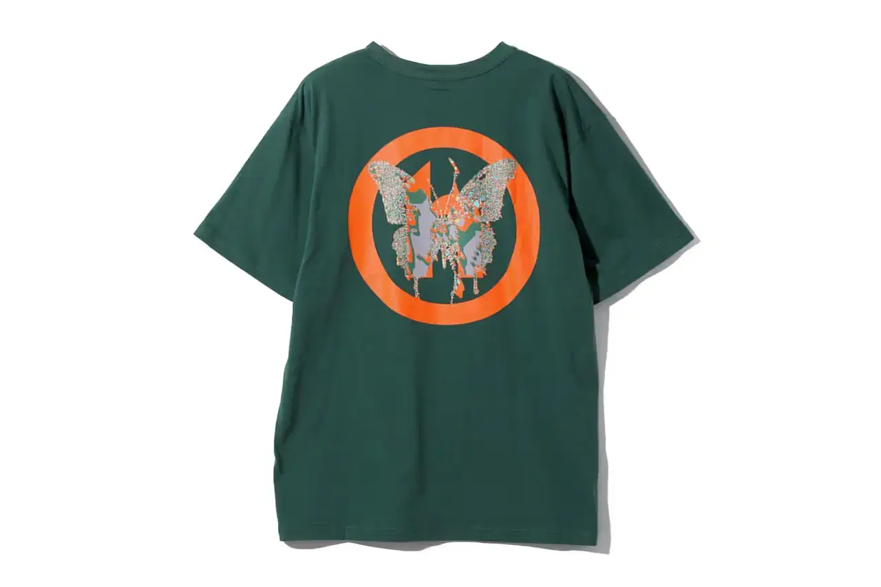 HIDDEN.NY AND NEEDLES UNVEIL LATEST COLLAB CAPSULE HIDDEN.NY and NEEDLES streetwear collaboration capsule collection featuring green hues, overlapping logos, and digital-inspired graphics on classic NEEDLES styles like Cut t-shirts, tracksuits, and mohair cardigans. Exclusive launch at NEPENTHES Tokyo on September 27, including unique REBUILD BY NEEDLES pieces