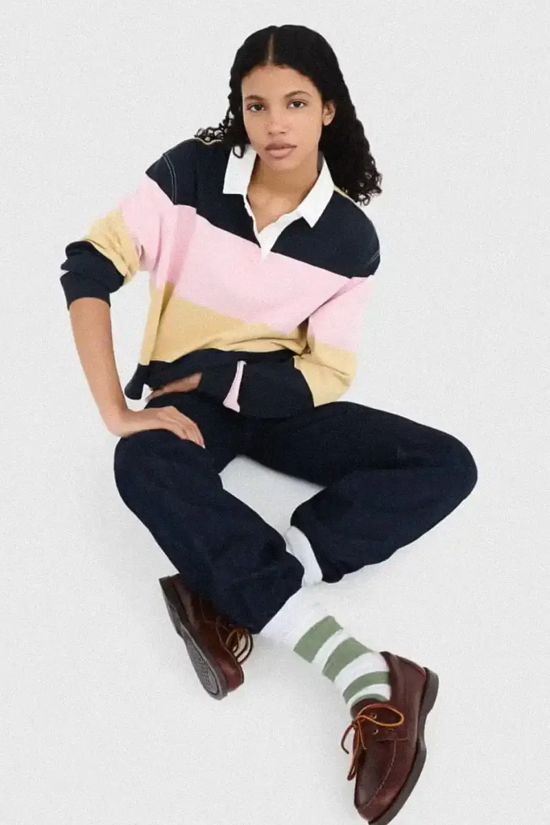 Uniqlo Models wearing Uniqlo x JW Anderson SS25 collection pieces, including blazers, button-ups, and casual wear in neutral tones against a white background (image 4 of 20)