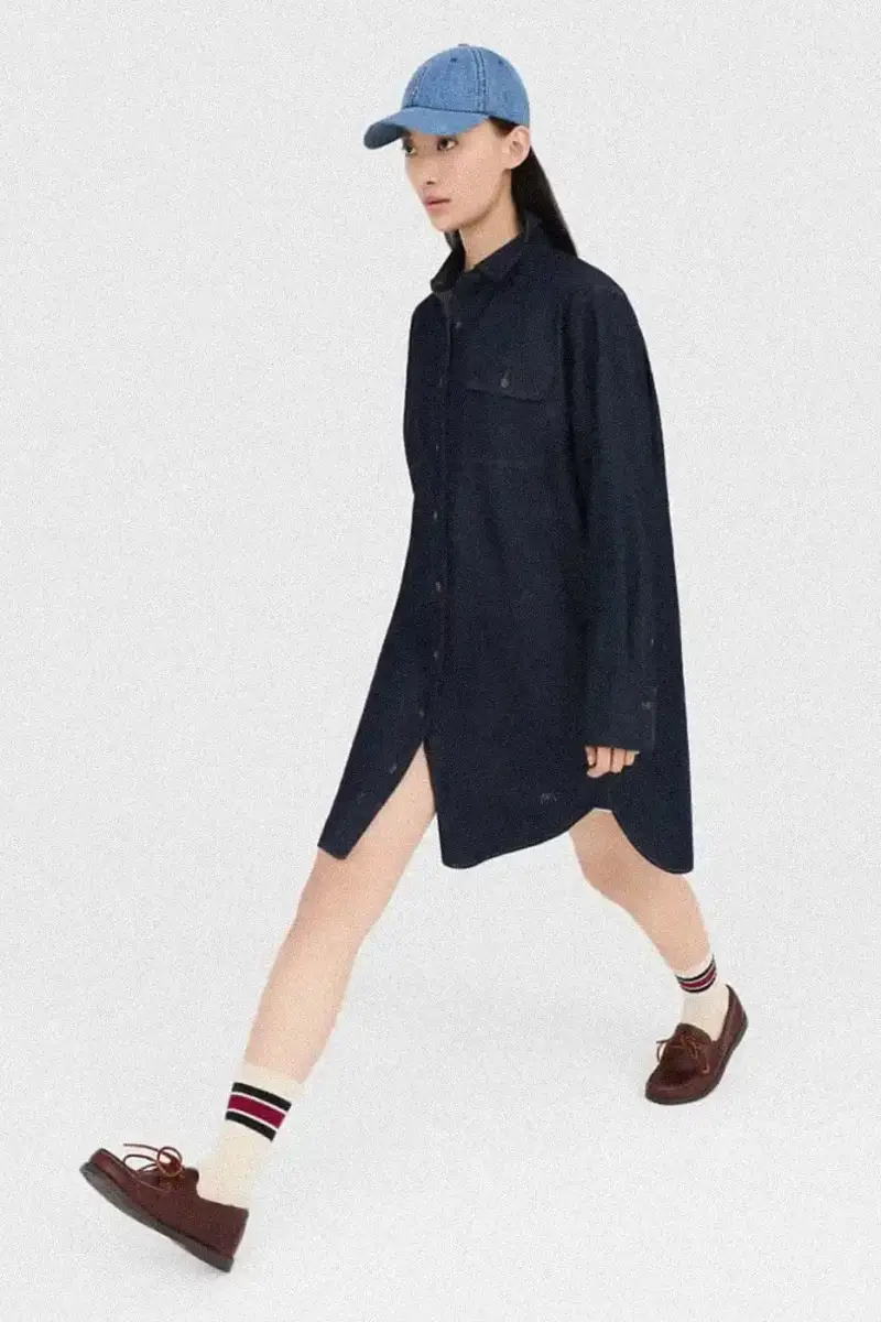 Uniqlo Models wearing Uniqlo x JW Anderson SS25 collection pieces, including blazers, button-ups, and casual wear in neutral tones against a white background (image 9 of 20)