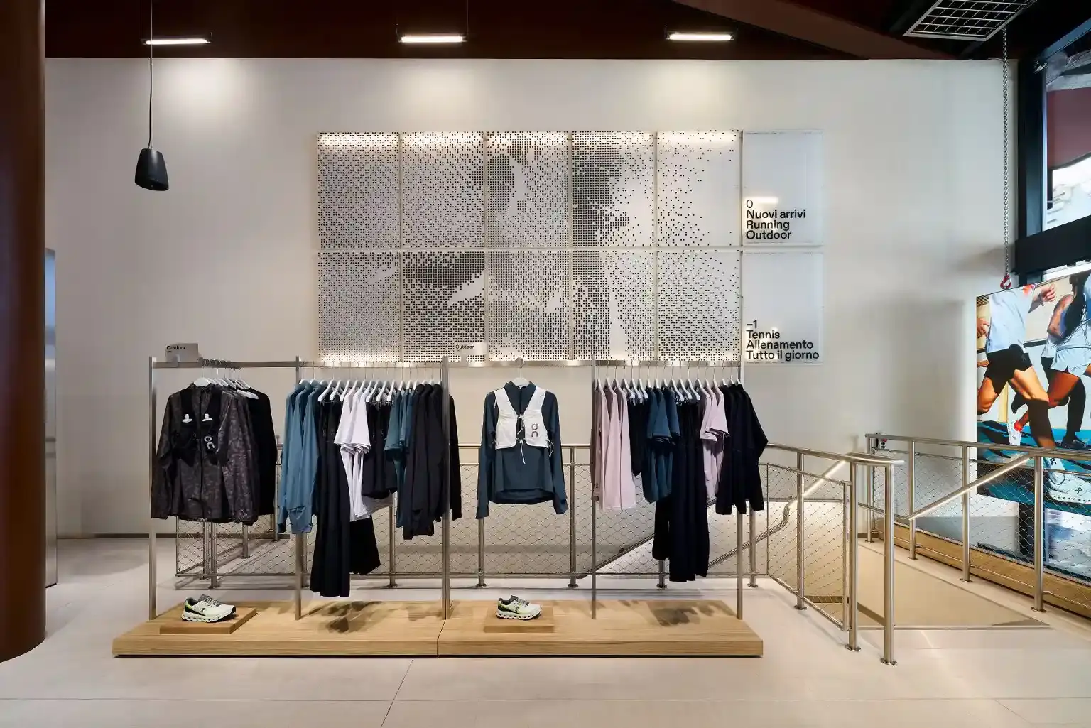 On, the Swiss sportswear brand, opens its first Italian flagship store in Milan's Corso Vittorio Emanuele II. The two-story, 480-square-meter store features innovative design by BBPR architects, including restored ceiling beams and a clay installation. It offers running gear, lifestyle products, and hosts community events. This opening marks On's significant expansion into the Italian market, blending Swiss engineering with Italian style in a prime fashion district location. (image 2 of 3)