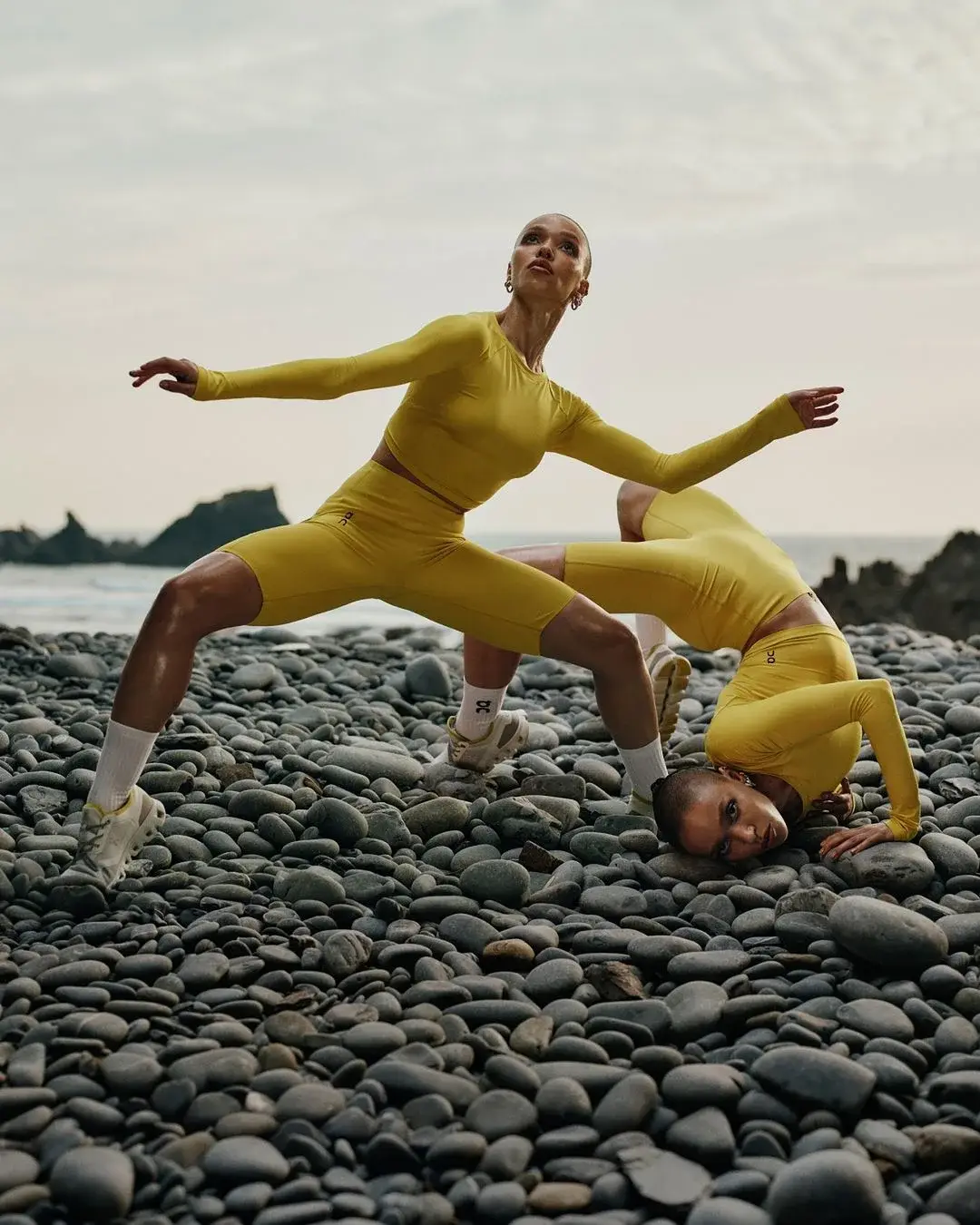 FKA twigs gracefully moving, embodying the theme ‘The Body is Art’ in On’s Autumn/Winter 2024 training campaign. Captured by photographer Jordan Hemingway, the image showcases the beauty of physical movement against a serene natural backdrop