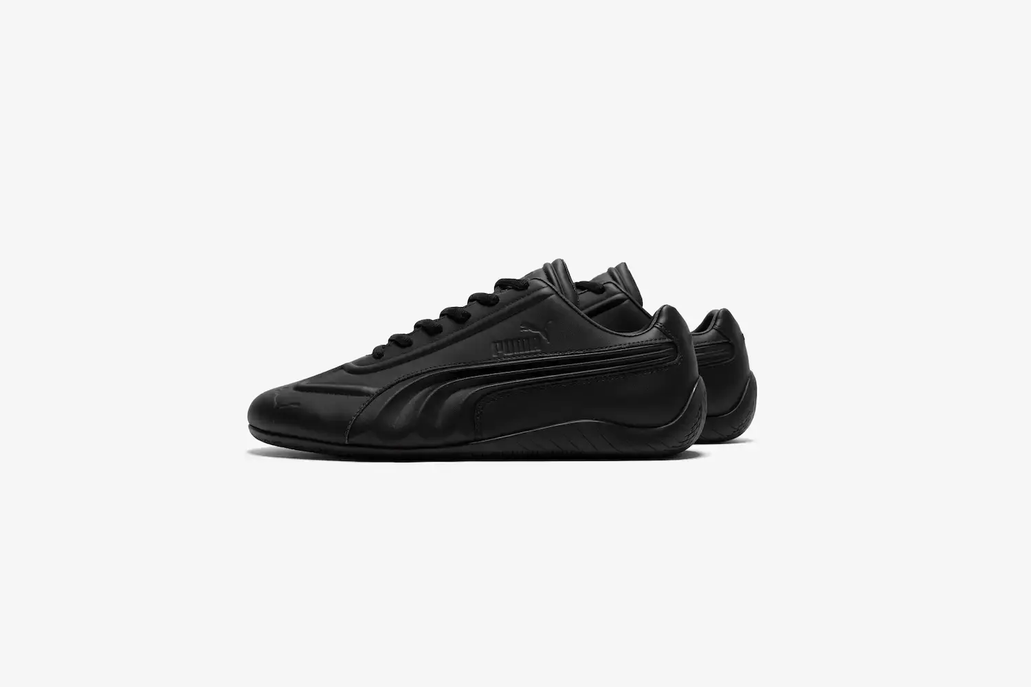 Juun.J/Puma PUMA x Juun.J Speedcat sneakers in high and low-top versions, featuring shadow colorways, curved Formstrip details, and tire-inspired soles against a neutral background. (image 2 of 2)
