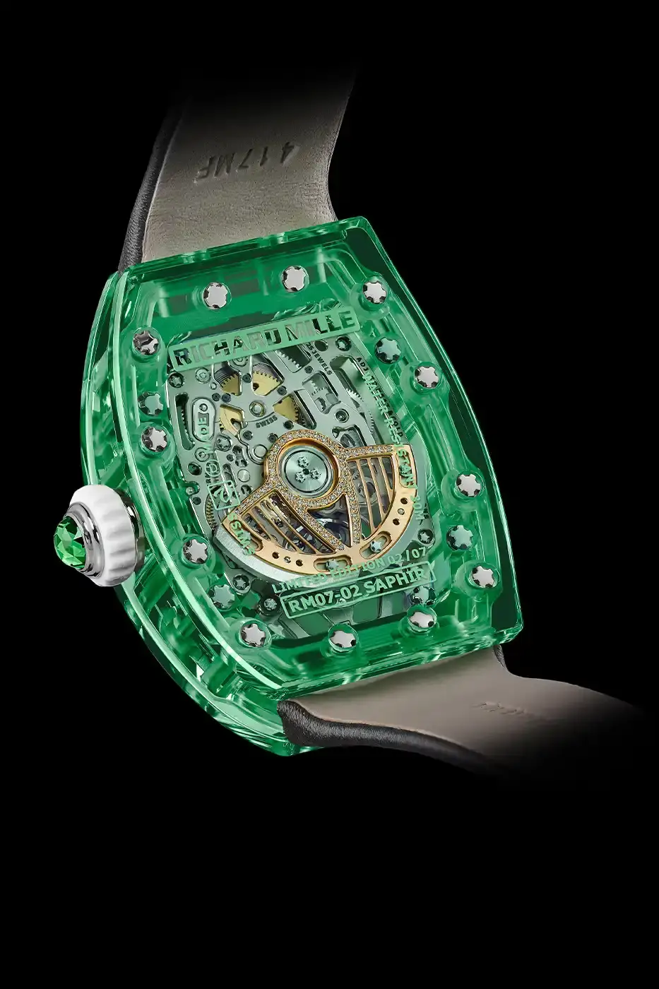 Richard Mille Richard Mille RM 07-02 luxury watch with a transparent colored sapphire crystal case. The watch features a geometric pattern dial set with precious stones including diamonds, sapphires, and ornamental stones. The skeletonized automatic movement is visible through the translucent case, showing intricate mechanical details and gold components. (image 6 of 22)