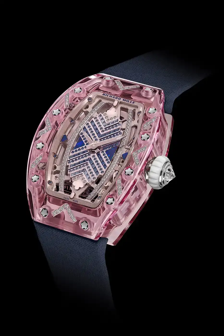Richard Mille Richard Mille RM 07-02 luxury watch with a transparent colored sapphire crystal case. The watch features a geometric pattern dial set with precious stones including diamonds, sapphires, and ornamental stones. The skeletonized automatic movement is visible through the translucent case, showing intricate mechanical details and gold components. (image 14 of 22)