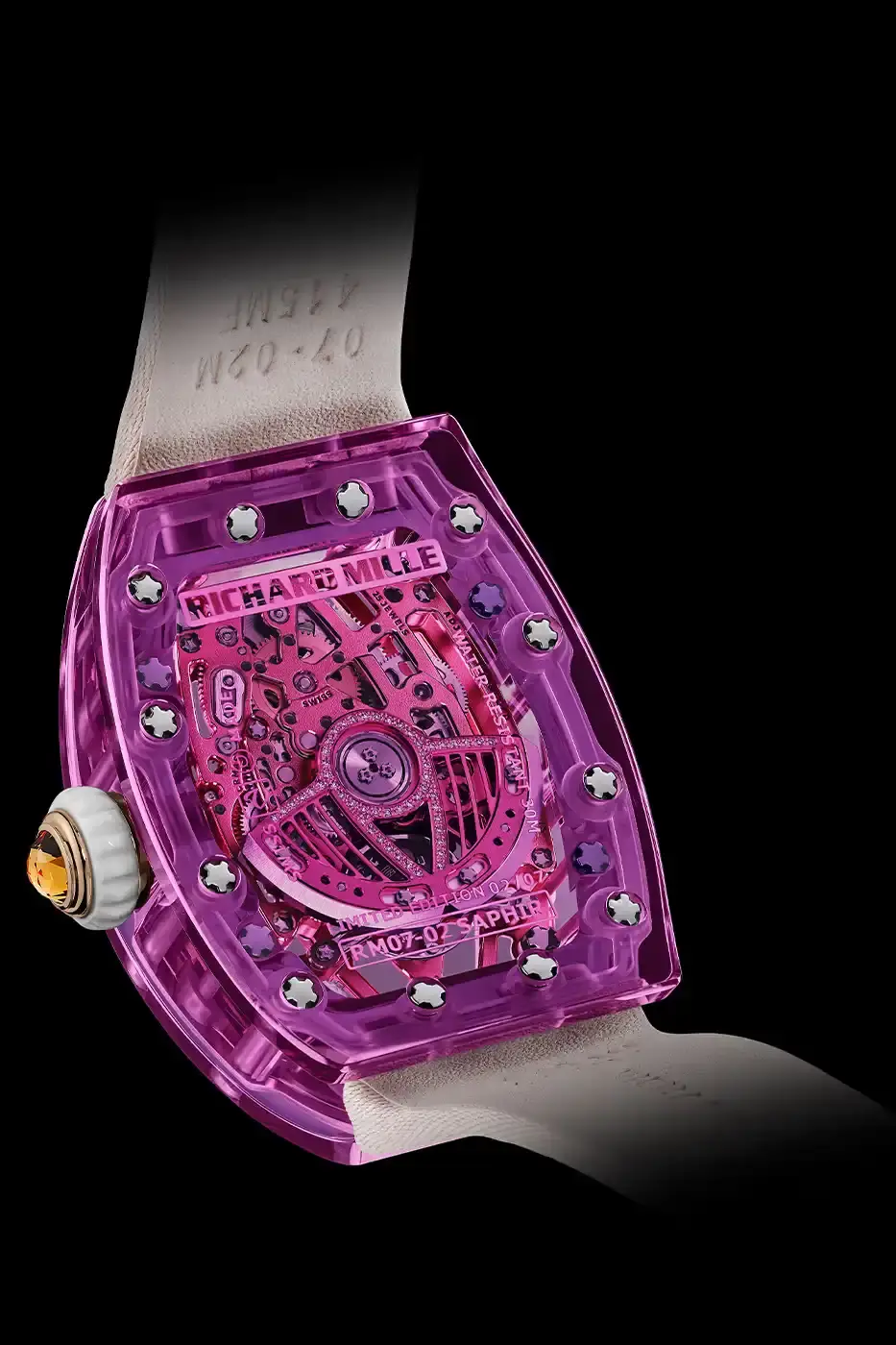 Richard Mille Richard Mille RM 07-02 luxury watch with a transparent colored sapphire crystal case. The watch features a geometric pattern dial set with precious stones including diamonds, sapphires, and ornamental stones. The skeletonized automatic movement is visible through the translucent case, showing intricate mechanical details and gold components. (image 18 of 22)