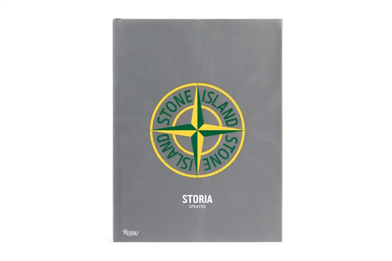 Stone Island The cover of the "Storia: Updated" book by Stone Island, a full-color monograph published by Rizzoli New York. The book's title and Stone Island's logo are prominently displayed against a textured background.