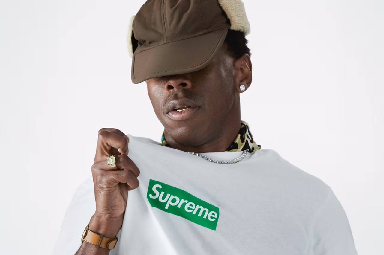 Supreme is set to collaborate with Grammy-winning artist Tyler, the Creator. The partnership, hinted at through street art in London’s Brick Lane and confirmed by Supreme’s Instagram, has fans excited. Tyler’s deep connection with Supreme dates back to his teenage years, making this collaboration a full-circle moment. The exact nature of the partnership is still under wraps, but it promises to be a significant event in fashion and music culture. Tyler’s influence on Supreme’s popularity in the early 2010s and his nostalgic recount of his first Supreme purchase highlight the brand’s impact on youth culture. As the streetwear community eagerly awaits more details, this collaboration is poised to be a landmark moment for both Supreme and Tyler, the Creator