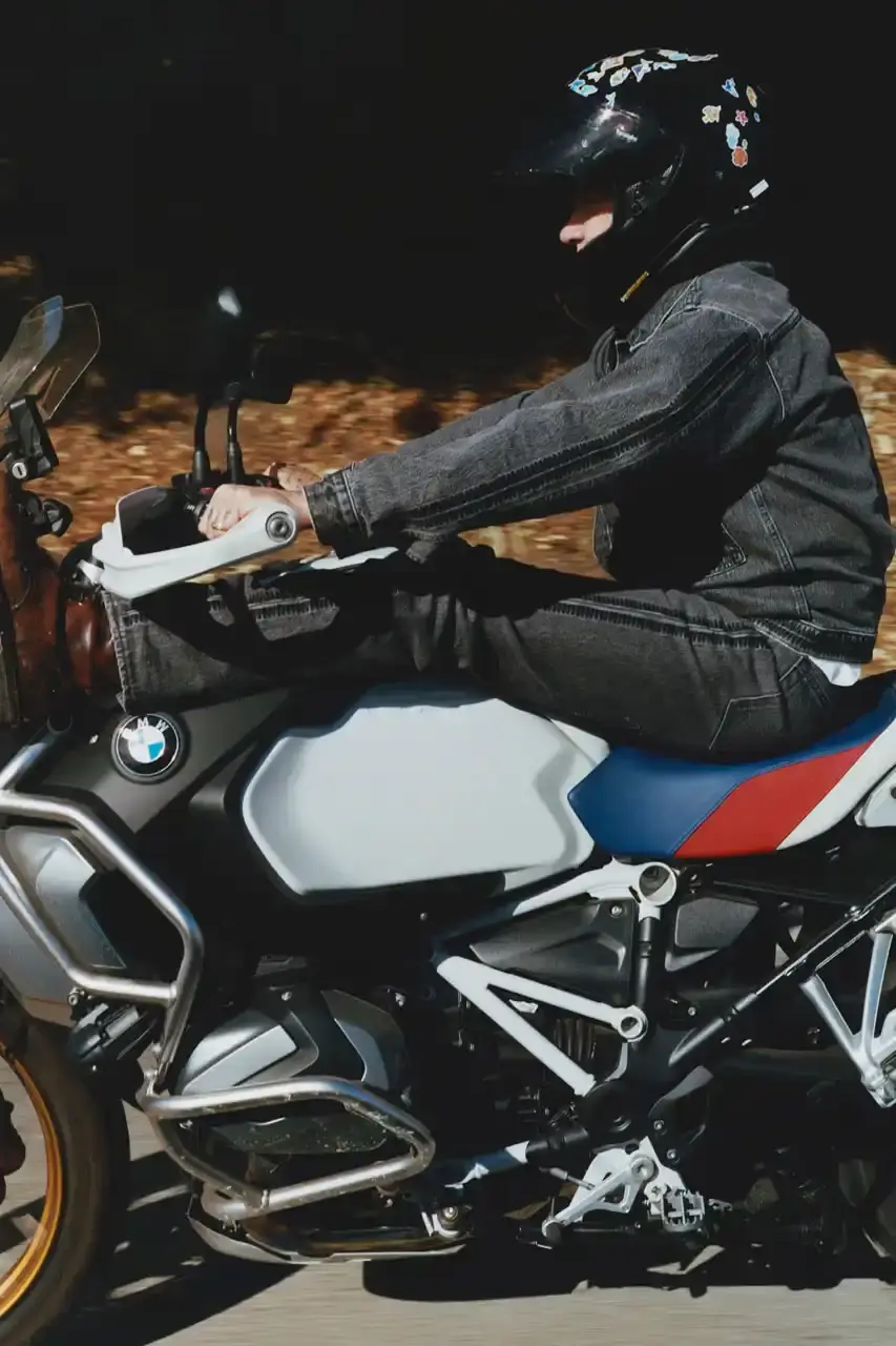 Levi's x UNDERCOVER Flea, bassist of Red Hot Chili Peppers, wearing a dark denim Levi's x UNDERCOVER Pinnacle Type II Trucker Jacket against a neutral background (image 11 of 15)